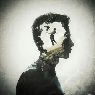 Silhouette of a head with a small figure inside, suggesting inner conflict
