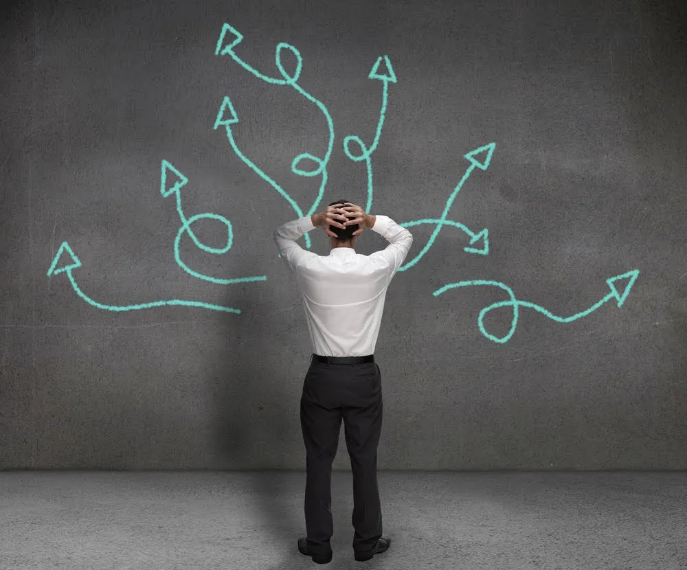 Writer facing tangled paths and arrows while struggling with story decisions